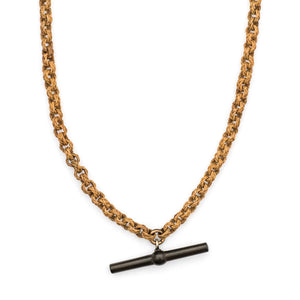 This unusual watch chain is made of finely woven rattan links creating a three dimensional cable style chain, complete with a T bar and hook clasp. Measuring at a very wearable 24" long, you can wear this chain layered with other pieces or alone paired with one of our antique gold fill lockets or charms. Close up chain view, showing t bar