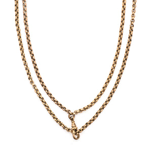This Pinchbeck antique watch chain features ever so slightly textured circular links, creating a light catching cable style chain, complete with a watch chain clasp. Close up view, with clasp