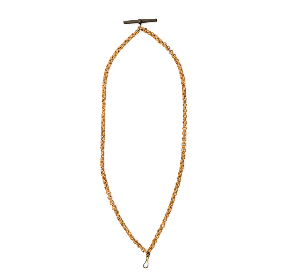 This unusual watch chain is made of finely woven rattan links creating a three dimensional cable style chain, complete with a T bar and hook clasp. Measuring at a very wearable 24" long, you can wear this chain layered with other pieces or alone paired with one of our antique gold fill lockets or charms. Close up chain view, showing t bar