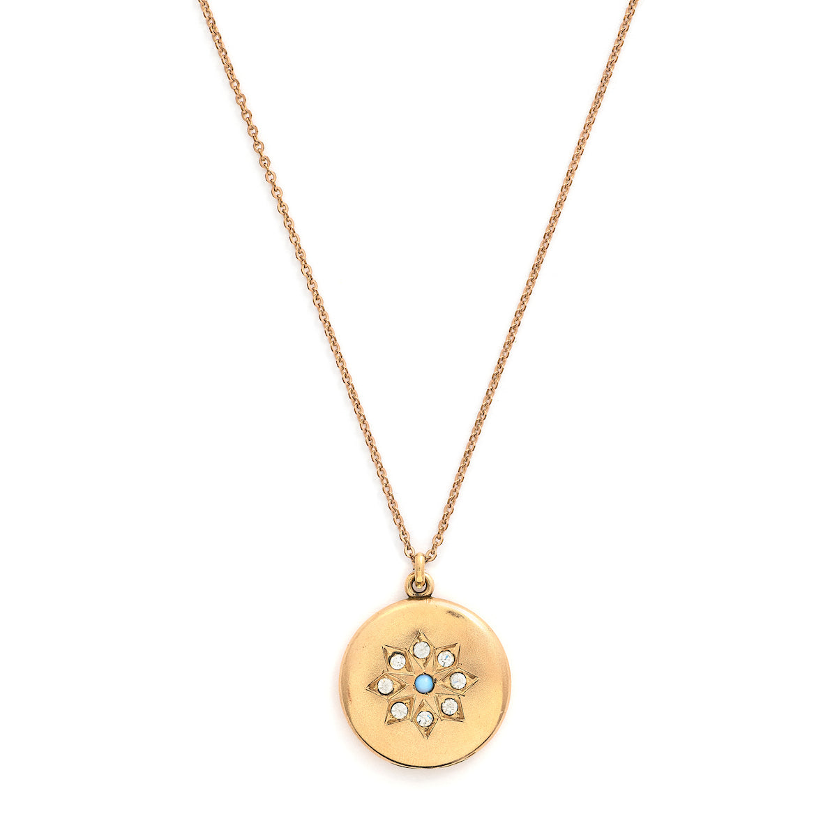 This round locket features a gorgeous opal at the center of a snowflake design, complete with white glass stones at each of the points. It opens to hold one photo, includes one original frame and pairs perfectly with one of our antique gold fill chains. Front locket view