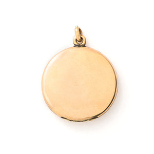 This round locket features a gorgeous opal at the center of a snowflake design, complete with white glass stones at each of the points. It opens to hold one photo, includes one original frame and pairs perfectly with one of our antique gold fill chains. Back locket view
