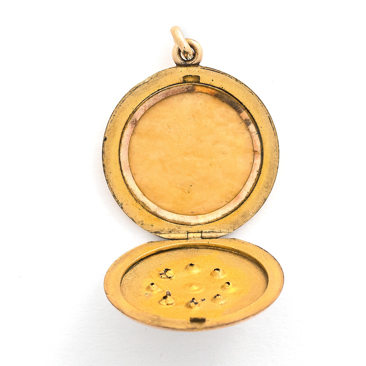 This round locket features a gorgeous opal at the center of a snowflake design, complete with white glass stones at each of the points. It opens to hold one photo, includes one original frame and pairs perfectly with one of our antique gold fill chains. Open locket view