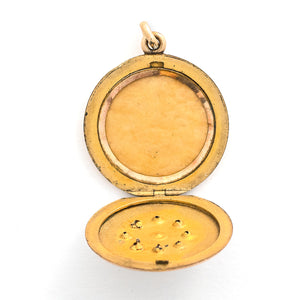 This round locket features a gorgeous opal at the center of a snowflake design, complete with white glass stones at each of the points. It opens to hold one photo, includes one original frame and pairs perfectly with one of our antique gold fill chains. Open locket view