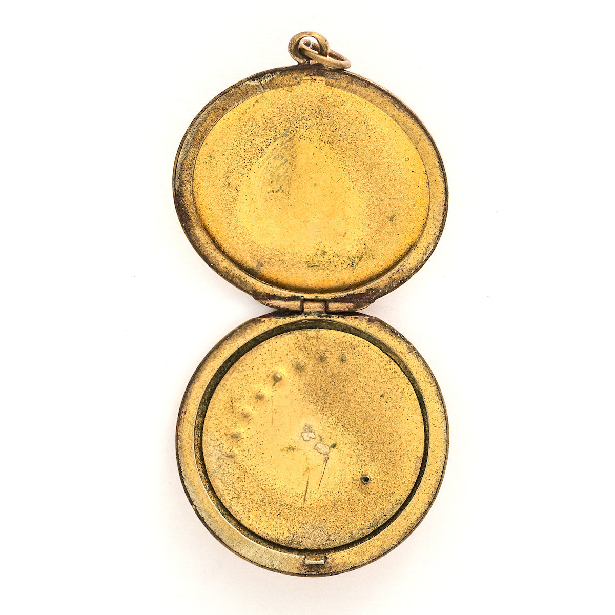 This Victorian round locket features a classic crescent moon and starburst, with a pearl encrusted crescent and jade as the center of the starburst. The letters "JO" are inscribed on the back. It opens to hold two photos and pairs perfectly with one of our antique gold fill chains. Open locket view