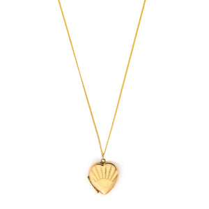 This lustrous 9K gold heart locket features a rising sun design across the entire front. It opened to hold two photos, has both original frames and paired with one of our vintage gold chains, this locket is the perfect symbol of love and new beginnings. Front locket view shown on chain