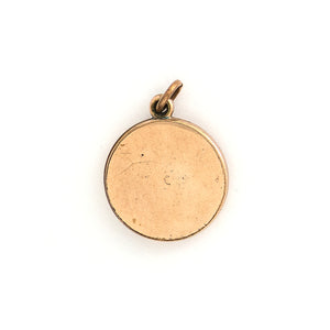 This simple round slide locket features 3 white glass stones and a minimalist thirds design. It slides opens to hold two photos and pairs perfectly with one of our antique gold fill chains.  Back locket view