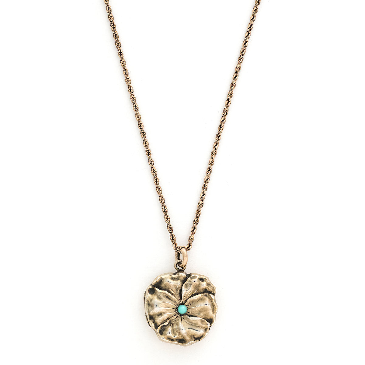 This incredible round locket features a sculpted pansy with a turquoise stone at its center. It is sterling silver with a gold wash and the textured petals catch the light at every turn. It opens to hold two photos and pairs perfectly with one of our antique sterling silver or gold fill chains. Front locket view