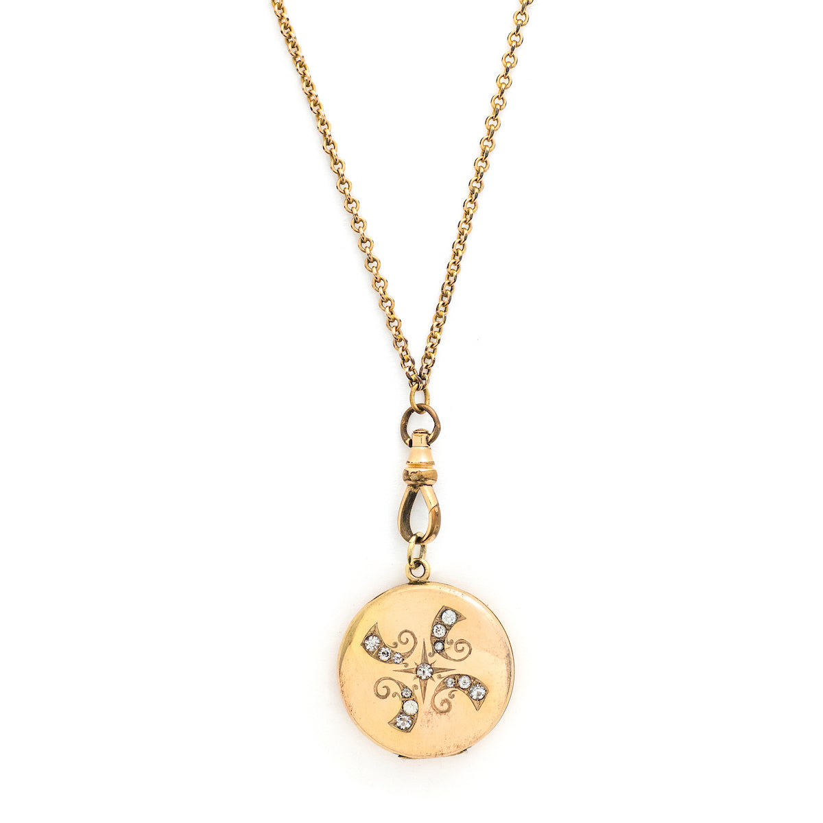 This radiant round locket features encrusted flourishes with the north star at its center. The initials MMP are inscribed on the back, it opens to hold two photos, includes both original frames and pairs perfectly with one of our antique gold fill chains.  Front locket view, shown on chain