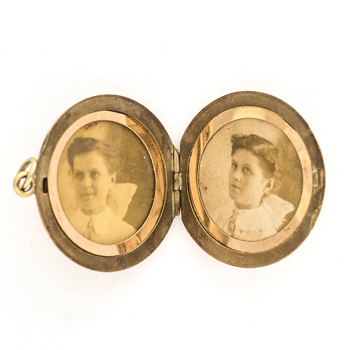 This radiant round locket features encrusted flourishes with the north star at its center. The initials MMP are inscribed on the back, it opens to hold two photos, includes both original frames and pairs perfectly with one of our antique gold fill chains.  Open locket view