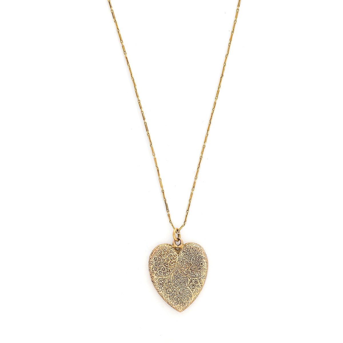 This heart shaped 14K gold locket features an earthy design reminiscent of tree roots with floral accents across the entire front and back of the locket. It opens to hold two photos, includes both original frames and pairs perfectly with one of our antique gold chains. Front locket view
