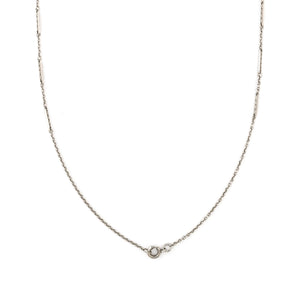 This dainty sterling silver vintage bar link watch chain features silver bars that are beautifully adorned with Xs on the front and back of each bar link. At 24", it pairs perfectly with one of our antique sterling silver or niello lockets, or worn on its own. Close up view, showing clasp