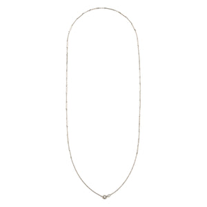 This dainty sterling silver vintage bar link watch chain features silver bars that are beautifully adorned with Xs on the front and back of each bar link. At 24", it pairs perfectly with one of our antique sterling silver or niello lockets, or worn on its own. Full chain view