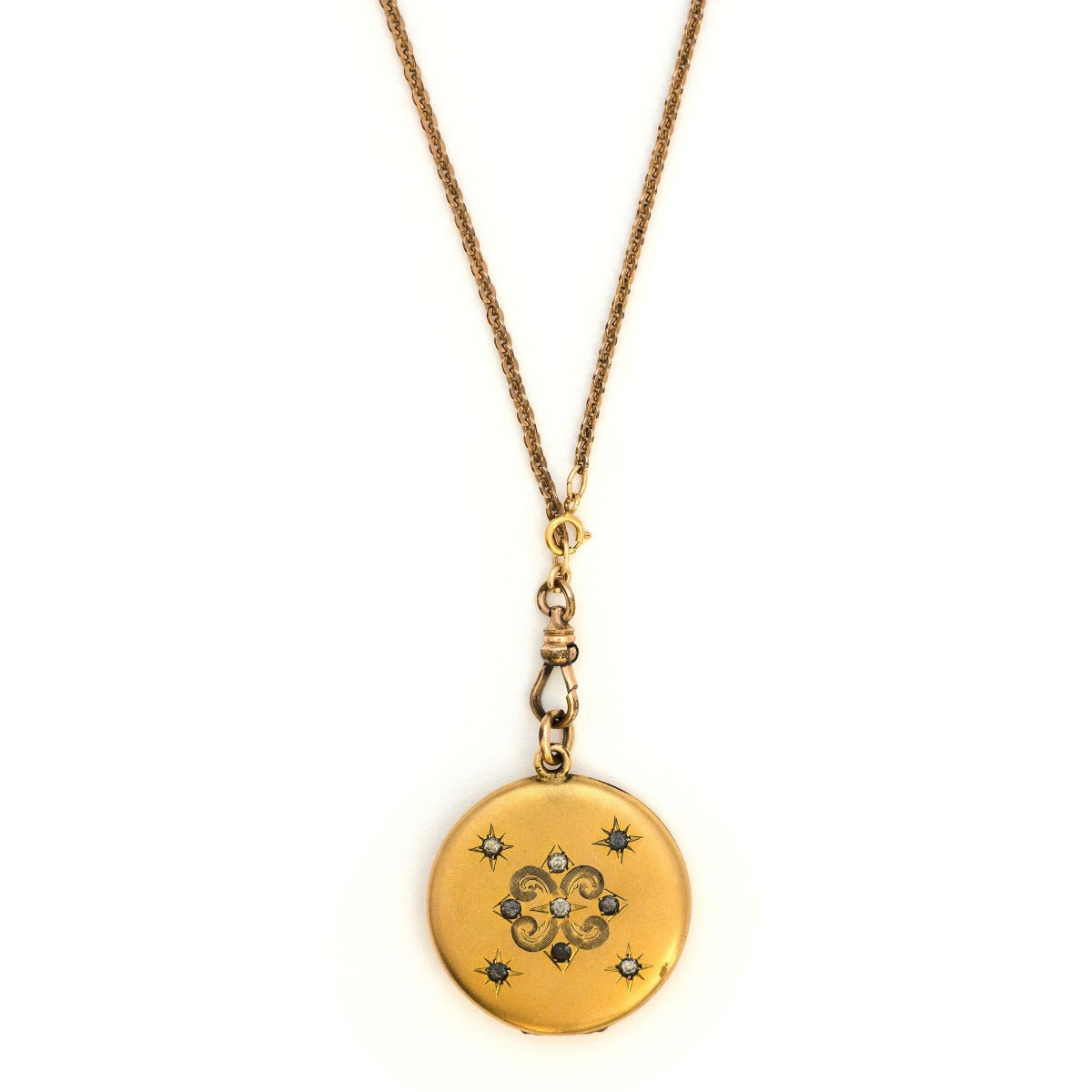 Stars in the Sky Antique Locket, gold fill locket with paste stones and starburst details. Perfect for holding pictures and photos. Front View