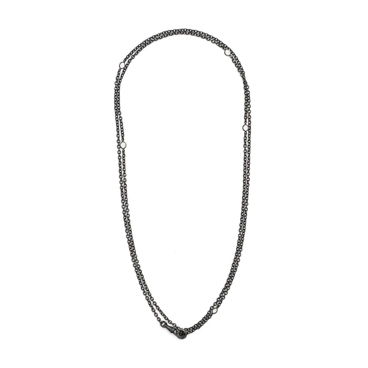 This long Victorian gunmetal chain measures 42" in length and features 5 incredibly cut glass stones. Doubled up on a swivel clasp, it is nearly 21" in length and would pair perfectly with either a vintage silver or gold locket. Full chain view