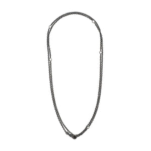 This long Victorian gunmetal chain measures 42" in length and features 5 incredibly cut glass stones. Doubled up on a swivel clasp, it is nearly 21" in length and would pair perfectly with either a vintage silver or gold locket. Full chain view